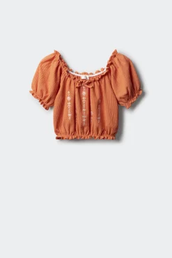 Blusa fruncida para niña