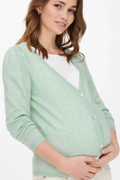 Chaqueta de punto premamá color verde claro.