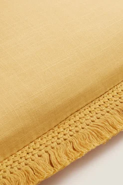 Funda cojín algodón flecos